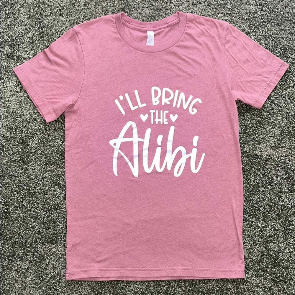 Bella + Canvas Pink Tee – “I’ll Bring the Alibi” – Medium